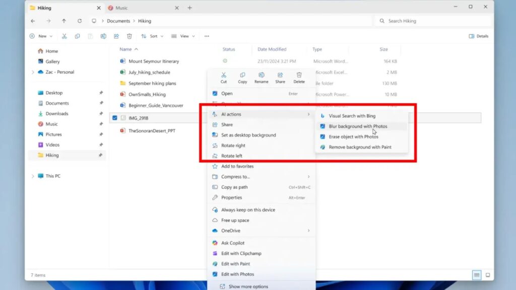 หน้าต่าง File Explorer ของ Windows 11 พร้อมเมนูคลิกขวาที่มีตัวเลือก AI Actions สำหรับแก้ไขภาพ เช่น เบลอพื้นหลัง ลบวัตถุ และลบพื้นหลัง แสดงอินเทอร์เฟซทันสมัย ธีมสีน้ำเงิน สื่อถึงการผสาน AI ในระบบปฏิบัติการ Windows 11